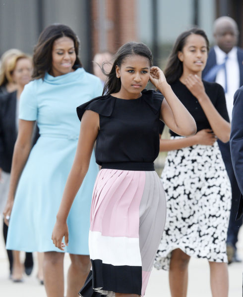 JOINT BASE ANDREWS, MD - SEPTEMBER 22:   First Lady Michelle Obama with daughters Sasha and Malia arrive to welcome His Holiness Pope Francis on his arrival from Cuba September 22, 2015 at Joint Base Andrews, Maryland. Francis will be visiting Washington, New York City and Philadelphia during his first trip to the United States as pope.  (Photo by Olivier Douliery-Pool/Getty Images)