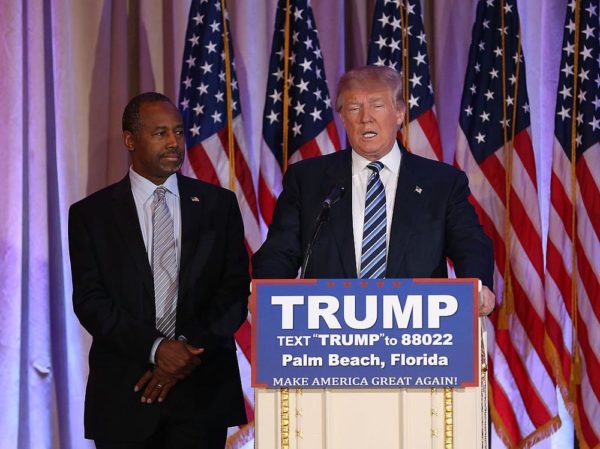PALM BEACH, FL - MARCH 11:  Republican presidential candidate Donald Trump stands with former presidential candidate Ben Carson as he receives his endorsement at the Mar-A-Lago Club on March 11, 2016 in Palm Beach, Florida. Presidential candidates continue to campaign before Florida's March 15th primary day.  (Photo by Joe Raedle/Getty Images)