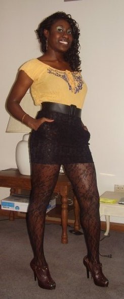Indian top, High-waist banded lace skirt, tights, booties and gold disc earings: All from West Seal
