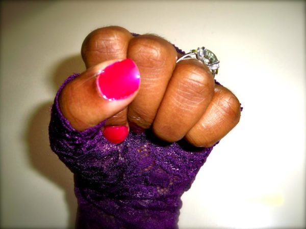  I love bright pink or red polish. Fingerless gloves and engagement ring. 