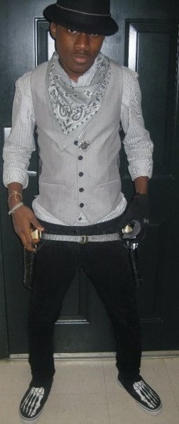 13 Fedora: Urban Outfitters; Bandana; Waistcoat: Topshop; Belt: American Apparel; Vans