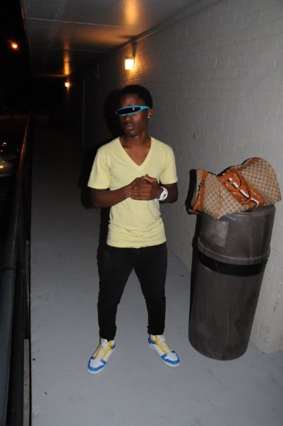 9 Shades: Linda Arrow; Shirt: bdx; Jeans: Topshop; Gucci luggage; Sneakers: Topshop