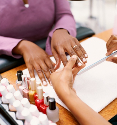 fixing her nail polish