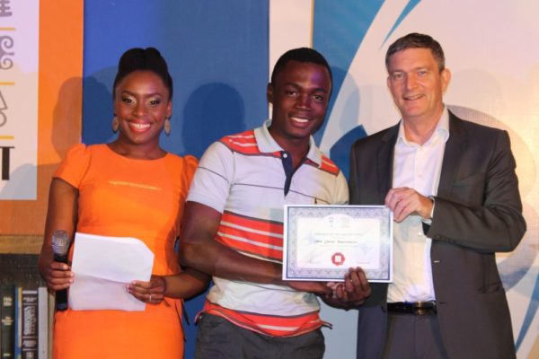 Mr.Arinze Ifeakandu, from University of Nigeria, Nsuka (second left), receiving his certificate of participation from the Managing Director/CEO, Nigerian Breweries Plc, Mr. Nico Vervelde, while the Creative Director, Farafina Trust, Chimamanda Adiche look on at the 2013 Literay Evening by Farafina Trust, sponsored by Nigerian Breweries, held at the Oriental Hotel, Victoria Island, Lagos.