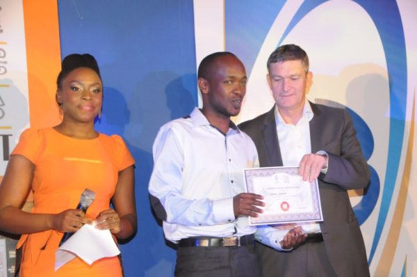 Mr. Kiprop kimutai, from Kenya (second left), receiving his certificate of participation from the Managing Director/CEO, Nigerian Breweries Plc, Mr. Nico Vervelde, while the Creative Director, Farafina Trust, Chimamanda Adiche look on at the 2013 Literay Evening by Farafina Trust, sponsored by Nigerian Breweries, held at the Oriental Hotel, Victoria Island, Lagos. 