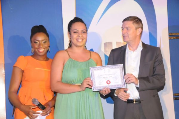 Mrs. Sifa Asani Gowon, from Jos (second left); receiving his certificate of participation from the Managing Director/CEO, Nigerian Breweries Plc, Mr. Nico Vervelde, while the Creative Director, Farafina Trust, Chimamanda Adiche look on at the 2013 Literay Evening by Farafina Trust, sponsored by Nigerian Breweries, held at the Oriental Hotel, Victoria Island, Lagos.