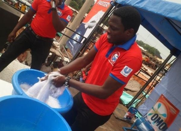 Ali Nuhu demonstrating the fast action power of the new OMO Detergent