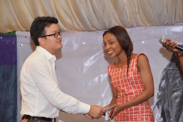 Funke Gina receiving her prize