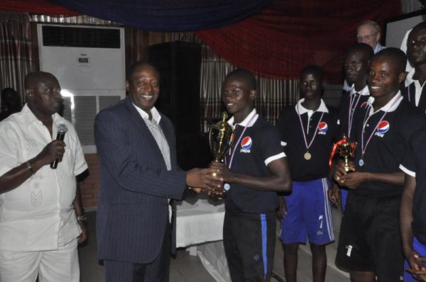 Director, Pepsi Football Academy, Chief Kashimawo Laloko and Technical Director, Nigeria Football Federation (NFF), Mr. Shuaibu Amodu, presenting the trophy to the winning team – PFA North