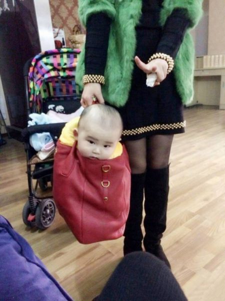 Baby in handbag