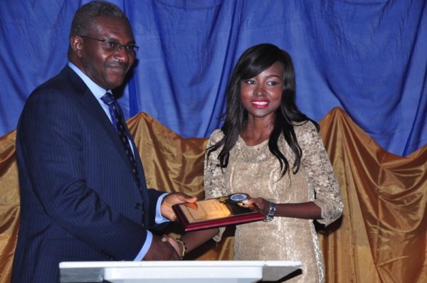 Oluwatosin Akingbulu receives her Award from Dr. Mike Okolo, Dean of the School of Media & Communications, Pan Atlantic University