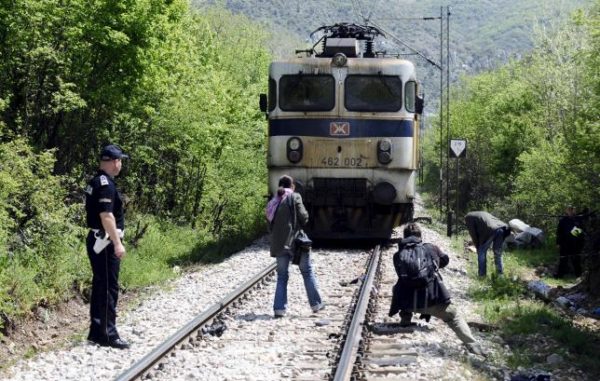 Media and police inspect at the scene where fourteen migrants were hit by a train, near Veles  April 24, 2015.  REUTERS/Ognen Teofilovski