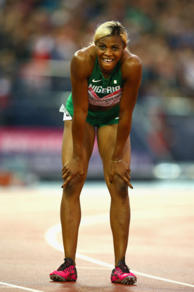 GLASGOW, SCOTLAND - JULY 31:  Blessing Okagbare of Nigeria rests after winning gold in the Women's 200m Final at Hampden Park during day eight of the Glasgow 2014 Commonwealth Games on July 31, 2014 in Glasgow, United Kingdom.  (Photo by Richard Heathcote/Getty Images)