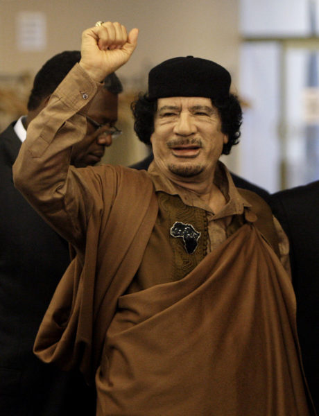 NEW YORK - SEPTEMBER 23:  Libyan leader Col. Muammar Gaddafi gestures as he enters the U.N. headquarters for the United Nations General Assembly on September 23, 2009 in New York City.  This is the 64th session of the United Nations General Assembly featuring leaders from over 120 countries.  (Photo by Rick Gershon/Getty Images)