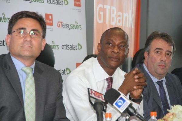 Chief Executive Officer, Etisalat Nigeria, Matthew Willsher; Managing Director and CEO of Guaranty Trust Bank Plc, Segun Agbaje; and Chief Marketing Officer, Etisalat Nigeria, Angelone Francesco 