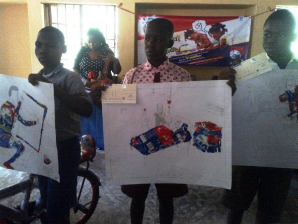 Peter Daniel (3rd Position), Science Primary School, Abuja; Mohammed Musa (2nd Position), Eucaristic Heart Of Jesus Model School and pupil of Lea Apo Village School, Friday Gowon, 1st Position and winner of 50 thousand naira in the Imagine and Achieve Art Competition in Abuja