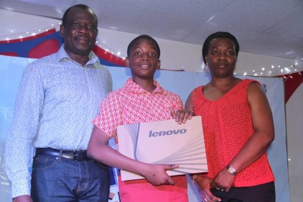 Brand Building Director, Unilever Nigeria, David Okeme; winner of the essay competition, Adedeji Adesida & His Mother at the Omo Imagine and Achieve Competition grand finale in Lagos