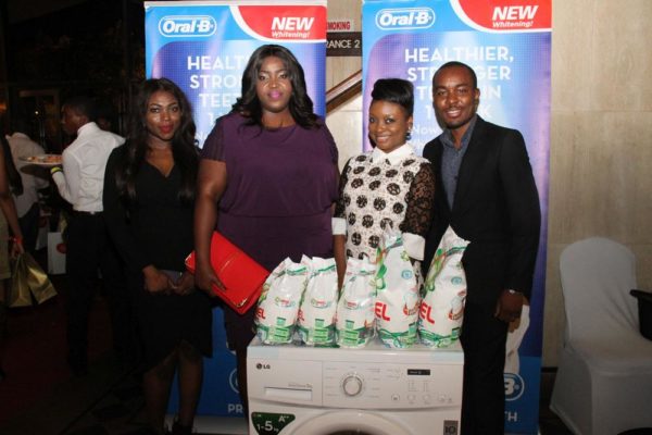  Media Manager, P&G Nigeria, Adigolo Funmilola; P&G's Commercial & Brand Operations Director, Enekabor Ehinomen; Winner of Oral B Smile of the Day competition with her washing machine, Adebanke Elegbede; and Folarin Ojo, Brand Manager for Oral B. 