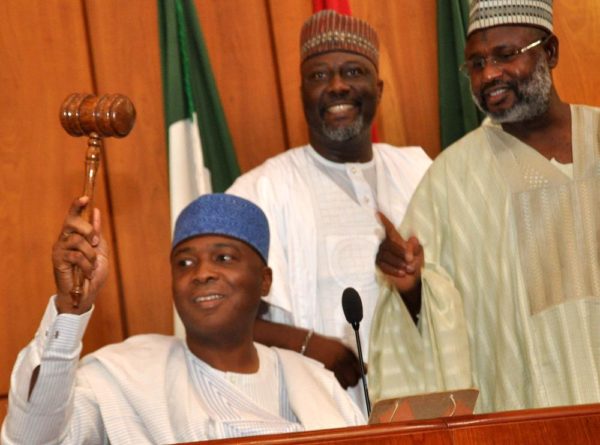 PIC.14.THE SENATE PRESIDENT, BUKOLA SARAKI USING THE GAVEL AT THE INAUGURATION OF THE 8TH NATIONAL ASSEMBLY IN ABUJA  ON TUESDAY (9/6/15).WITH HIM ARE SENATORS DINO MELAIYE (M) AND SANI YERIMA 3014/9/6/2015/CH/BJO/NAN