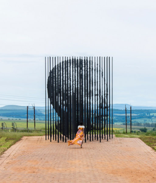 Vimbai at Nelson Mandela capture site in her Toju Foyeh high low dress