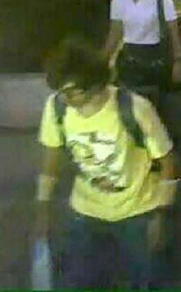 ©Nicholas Razzell 18.08.15 M) 07976 449 585ref: nxr Pic shows: Security camera CCTV released today by the Thai Authorities showing a male suspect wearing a yellow shirt near the Erawan Shrine in Bangkok who was seen with a plastic bag and backpack, only to appear later without Tthe backpack. - see story. Pic by: Nick Razzell