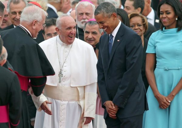JOINT BASE ANDREWS, MD - SEPTEMBER 22:  Pope Francis (C) is escorted by U.S. President Barack Obama (3rd R) and first lady Michelle Obama (R) as he greets and other political and Catholic church leaders after arriving from Cuba September 22, 2015 at Joint Base Andrews, Maryland. Francis will be visiting Washington, New York City and Philadelphia during his first trip to the United States as Pope.  (Photo by Chip Somodevilla/Getty Images)