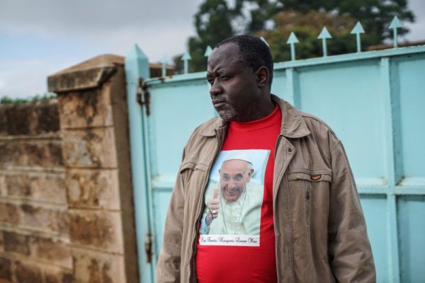 NAIROBI, KENYA - NOVEMBER 24: Father Paschal Mwijage of the St. Joseph the Worker Parish in Nairobi's Kangemi slum wears a t-shirt of Pope Francis on November 24, 2015 in Kenya. Pope Francis makes his first visit to Kenya on a five day African tour that is scheduled to include Uganda and the Central African Republic. Africa is recognised as being crucial to the future of the Catholic Church with the continent's Catholic numbers growing faster than anywhere else in the world. (Photo by Nichole Sobecki/Getty Images)