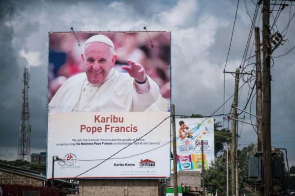 NAIROBI, KENYA - NOVEMBER 24: A poster welcoming Pope Francis to Kenya is pictured in the Kangemi slum on November 24, 2015 in Nairobi, Kenya. Pope Francis makes his first visit to Kenya on a five day African tour that is scheduled to include Uganda and the Central African Republic. Africa is recognised as being crucial to the future of the Catholic Church with the continentís Catholic numbers growing faster than anywhere else in the world. (Photo by Nichole Sobecki/Getty Images)