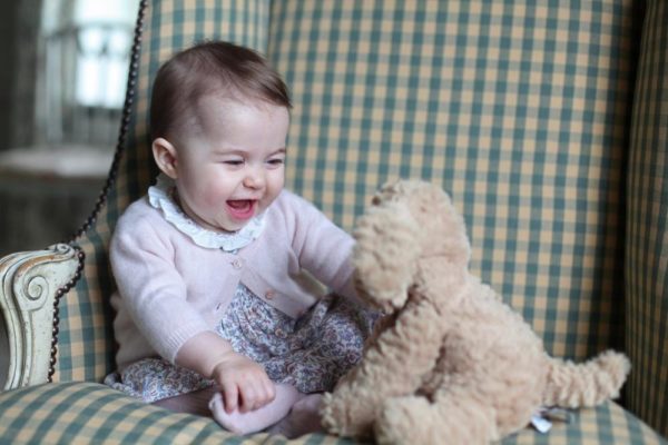 ANMER HALL, ENGLAND - UNDATED:  In this undated handout photo provided by HRH The Duchess of Cambridge, Princess Charlotte of Cambridge plays with a teddy as she is seen at Anmer Hall earlier this month taken by Catherine, Duchess of Cambridge in Sandringham, England. (Photo by HRH The Duchess of Cambridge via Getty Images) EDITORIAL USE ONLY. NO COMMERCIAL USE (including any use in merchandising, advertising or any other non-editorial use including, for example, calendars, books and supplements). This photograph is provided to you strictly on condition that you will make no charge for the supply, release or publication of it and that these conditions and restrictions will apply (and that you will pass these on) to any organisation to whom you supply it. All other requests for use should be directed to the Press Office at Kensington Palace in writing.