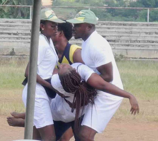 PIC. 14. CORPS MEMBERS EVACUATING THEIR A FEMALE COLLEAGUE THAT COLLAPSED DURING THE EARLY MORNING DRILL, AT  NYSC PERMANENT ORIENTATION CAMP, GBAKUTA VILLAGE, ON ISEYIN-OKEHO ROAD, IN OYO STATE ON MONDAY (9/11/15). 7074/9/11/2015/IBRO/BJO/NAN