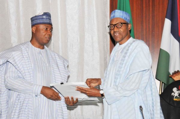 PIC. 15. PRESIDENT MUHAMMADU BUHARI (R), RECEIVING THE LIST OF  SCREENED AND CONFIRMED MINISTER DESIGNATES FROM THE SENATE PRESIDENT  BUKOLA SARAKI, AT THE PRESIDENTIAL VILLA IN ABUJA ON TUESDAY  (3/11/15). 6894/3/11/2015/ICE/BJO/NAN