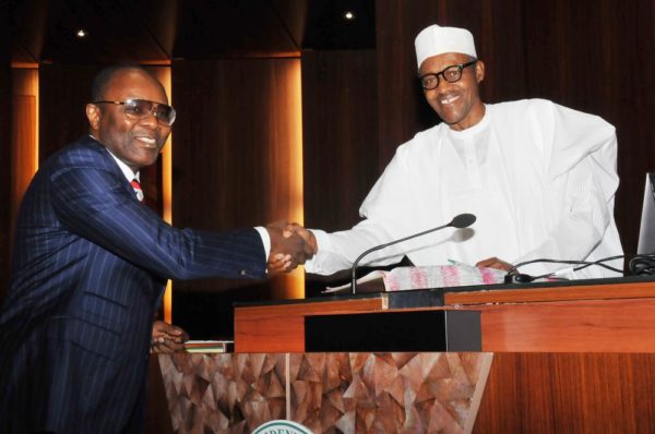 PIC.11. PRESIDENT MUHAMMADU BUHARI (R), CONGRATULATING DR EMMANUEL IBE-KACHIKWU, AFTER HIS OATH OF OFFICE AS THE MINISTER OF OF STATE FOR PETROLEUM, AT THE PRESIDENTIAL VILLA IN ABUJA ON WEDNESDAY WEDNESDAY (11/11/15). 7118/11/11/2015/ICE/JAU/NAN