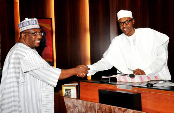 PIC.10. PRESIDENT MUHAMMADU BUHARI (R), CONGRATULATING RETIRED LT.-GEN. ABDURAHMAN DAMBAZAU, AFTER TAKING HIS OATH OF OFFICE AS THE MINISTER OF INTERIOR, AT THE PRESIDENTIAL VILLA IN ABUJA ON WEDNESDAY (11/11/15). 7117/11/11/2015/ICE/JAU/NAN