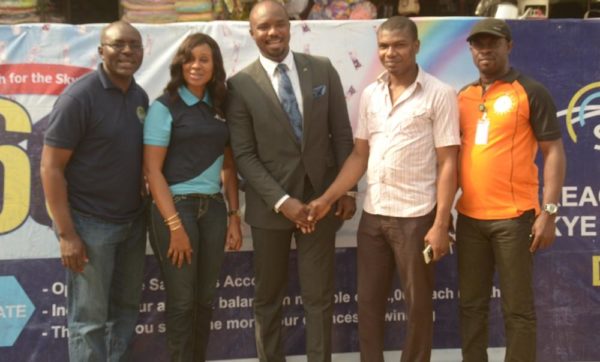 L-R: Business Development Manager, Eziukwu Road Branch , Aba, Chinedu Oguejiofor, Head, Retail Banking ,Nkolika Okoli, Regional Director , South East 2, Chukwudi Onuegbu, Winner, N250,000 at Ariaria Market today, A businessman, Chinonso Ezeanya and Assistant Manager, National Lottery Regulatory Commission, Opara Celestine at the Bank's “Reach For The Skye” reward draw held in Ariaria International Market, Aba in Abia State on 21st January , 2016