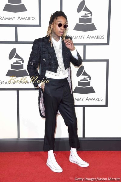 Wiz Khalifa in a pearl encrusted vest worn under a cropped black blazer with a pair of ankle-length pants by Thom Browne
