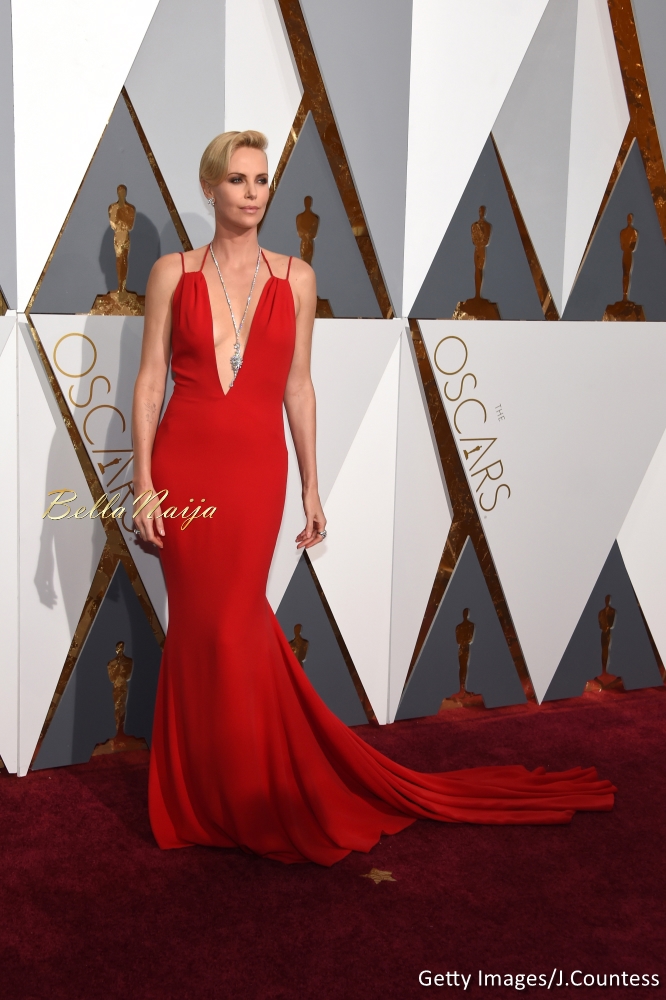 Charlize Theron wearing a Dior Haute Couture dress and $3.7 million worth of Harry Winston diamonds