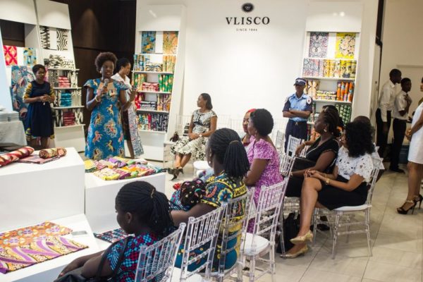 A cross section of Customers listening to the Vlisco Marketing Manager, Adaeze Alilonu
