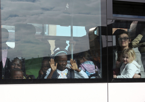 BRUSSELS, BELGIUM - MARCH 22: Crew and passengers are evacuated by bus from Zaventem Bruxelles International Airport after terrorist attacks on March 22, 2016 in Brussels, Belgium. At least 13 people are though to have been killed after Brussels airport was hit by two explosions whilst a Metro station was also targeted. The attacks come just days after a key suspect in the Paris attacks, Salah Abdeslam, was captured in Brussels. (Photo by Sylvain Lefevre/Getty Images)