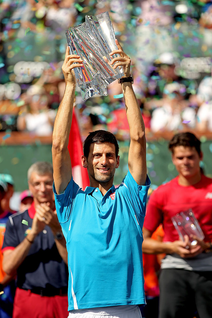 INDIAN WELLS, CA - MARCH 20: Novak Djokovic of Serbia celebrates with the winner's trophy after defeating Milos Raonic of Canada during the mens final of the BNP Paribas Open at the Indian Wells Tennis Garden on March 20, 2016 in Indian Wells, California. (Photo by Matthew Stockman/Getty Images)