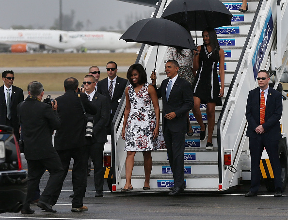 HAVANA, CUBA - MARCH 20:  President Barack Obama, Michelle Obama and Sasha Obama (R) walk down the stairs as they arrive at Jose Marti International Airport on Airforce One for a 48-hour visit on March 20, 2016 in Havana, Cuba. Mr. Obama's visit is the first in nearly 90 years for a sitting president, the last one being Calvin Coolidge.  (Photo by Joe Raedle/Getty Images)