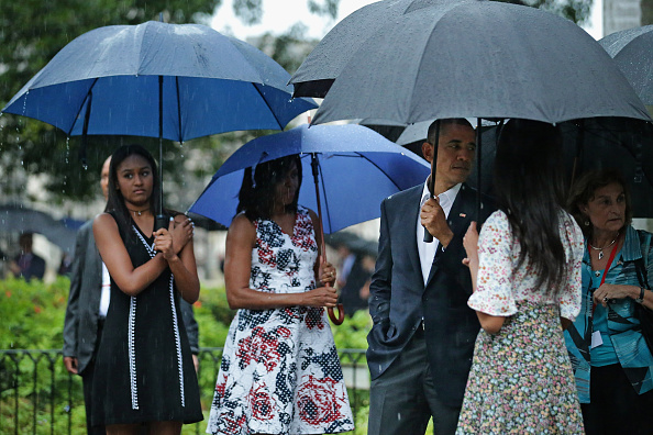 HAVANA, CUBA - MARCH 20: (L-R) Sasha Obama, 14, first lady Michelle Obama, U.S. President Barack Obama and Malia Obama, 17, pause to look at a statue of Cuban independence hero Carlos Manuel de Cespedes during a walking tour of the plaza of the 18th century Catedral de San Cristobal de la Habana in the Old Havana neighborhood March 20, 2016 in Havana, Cuba. Obama is the first sitting president to visit Cuba in nearly 90 years. (Photo by Chip Somodevilla/Getty Images)