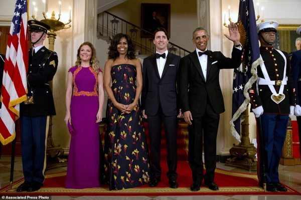 President Barack Obama, right, waves with from left, Sophie Grégoire Trudeau, first lady Michelle Obama, and Canadian Prime Minister Justin Trudeau, as they pose for a photograph at the White House during the State Dinner in Washington, Thursday, March 10, 2016. (AP Photo/Jacquelyn Martin)
