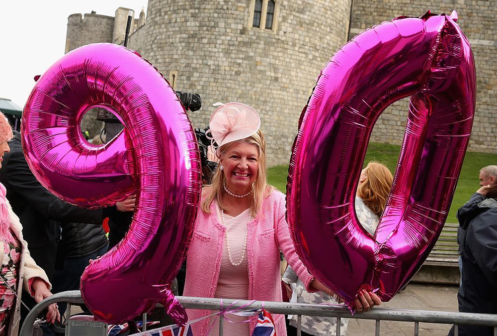 WINDSOR, ENGLAND - APRIL 21: Judy Daley from Cardiff waits in position for the Queen's 90th Birthday Walkabout on April 21, 2016 in Windsor, England. Today is Queen Elizabeth II's 90th Birthday. The Queen and Duke of Edinburgh will be carrying out engagements in Windsor. (Photo by Chris Jackson/Getty Images)