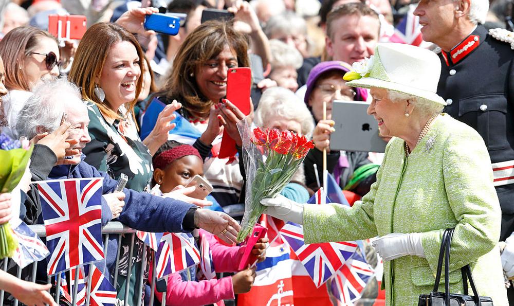 WINDSOR, UNITED KINGDOM - APRIL 21: (EMBARGOED FOR PUBLICATION IN UK NEWSPAPERS UNTIL 48 HOURS AFTER CREATE DATE AND TIME) Queen Elizabeth II meets the public during her 90th Birthday Walkabout on April 21, 2016 in Windsor, England. Today is Queen Elizabeth II's 90th Birthday. (Photo by Max Mumby/Indigo/Getty Images)