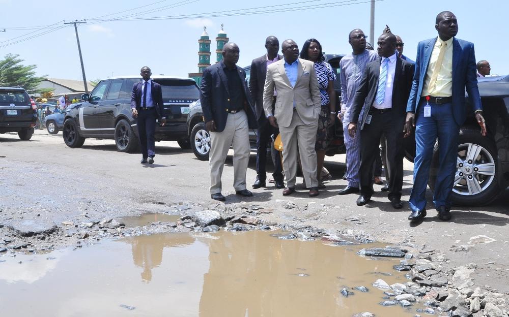 Lagos State Governor, Akinwunmi Ambode (2nd left), with his Special Adviser on Lagos Global, Prof. Ademola Abass (3rd left) and Managing Director, Lagos State Waterways Authority (LASWA), Engr. Abisola Kamson (middle) during his inspection of the bad portion of Berlett Bus Stop on Apapa- Oshodi Expressway, Lagos, on Friday, May 13, 2016