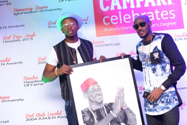 Artist, Folabi David and 2Baba during the 2Baba painting presentation