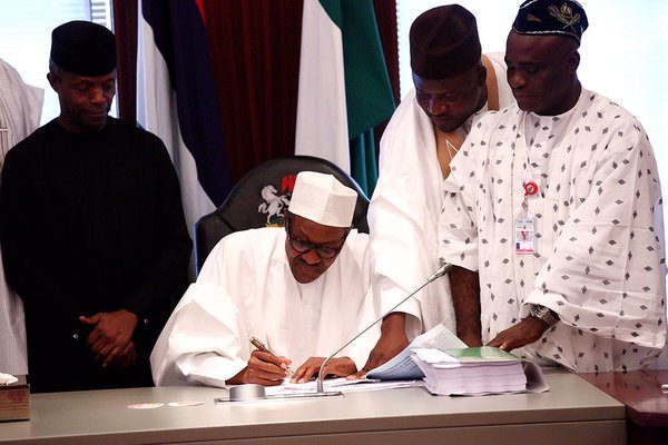 President Buhari Signing the 2016 Appropriation Bill into Law. Credit: twitter.com/NGRPresident