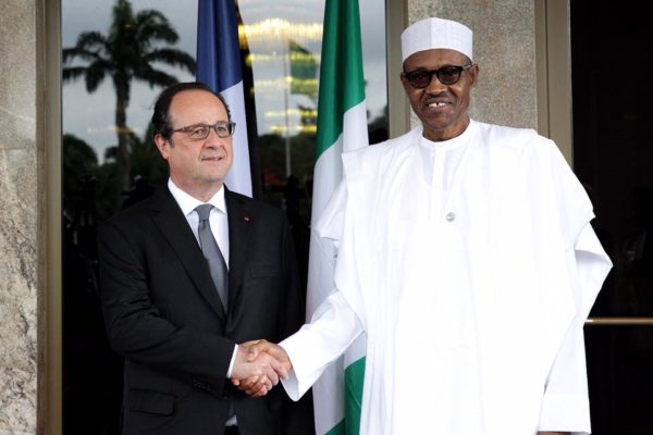 President Muhammadu Buhari (R) welcoming French President Francois Hollande to the State House, Abuja