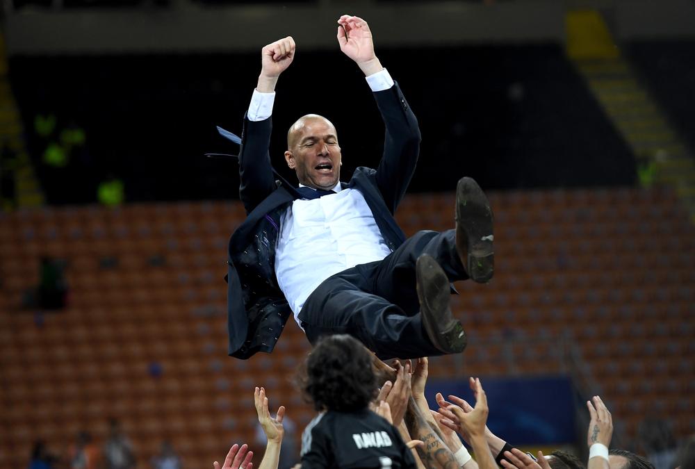 MILAN, ITALY - MAY 28: Real Madrid head Zinedine Zidane is thrown in the air after the UEFA Champions League Final match between Real Madrid and Club Atletico de Madrid at Stadio Giuseppe Meazza on May 28, 2016 in Milan, Italy. (Photo by Matthias Hangst/Getty Images)