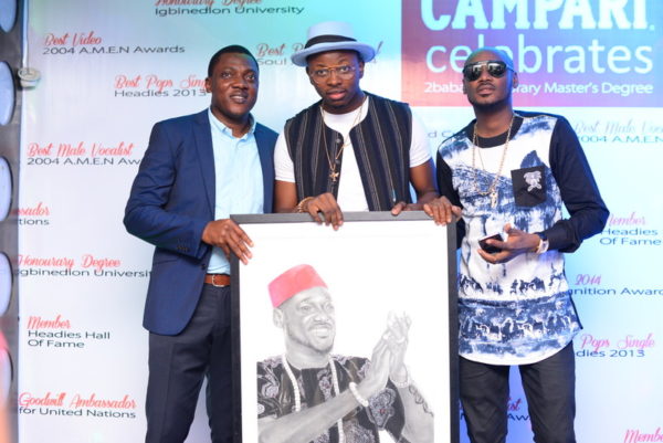 Head of Marketing, Brian Munro Limited, Abayomi Ajao, Folabi David and 2Baba during the 2Baba painting presentation